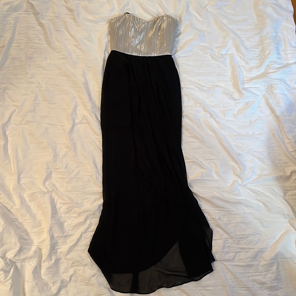Black and silver strapless maxi dress with front slit with two layers.